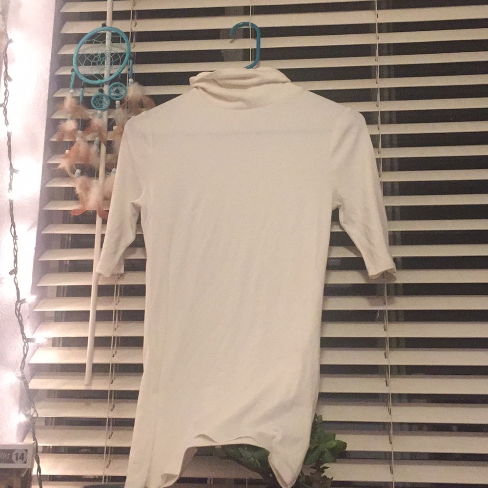 White turtle neck top